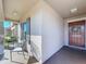 Welcoming front porch featuring comfortable seating, garden, and decorative door wreath at 197 Rain Berry Ave, Ruskin, FL 33570