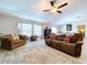 Spacious living room with comfortable seating, tile floors, and bright natural light at 197 Rain Berry Ave, Ruskin, FL 33570