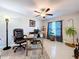Bright home office with tile floors, a ceiling fan, and natural light at 197 Rain Berry Ave, Ruskin, FL 33570