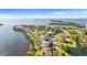 Expansive waterfront property with beautiful homes, lush landscaping, and stunning bay views at 2077 N Pointe Alexis Dr, Tarpon Springs, FL 34689