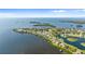 Spectacular aerial perspective features waterfront homes with private docks and bay access at 2077 N Pointe Alexis Dr, Tarpon Springs, FL 34689