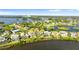 Gorgeous aerial view showcases waterfront homes, lush landscaping, and stunning bay views at 2077 N Pointe Alexis Dr, Tarpon Springs, FL 34689