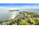 Stunning waterfront home with panoramic views of the bay, lush landscaping, and a private setting at 2077 N Pointe Alexis Dr, Tarpon Springs, FL 34689