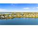 Expansive aerial reveals waterfront community with easy bay access, serene lake views, and mature trees at 2077 N Pointe Alexis Dr, Tarpon Springs, FL 34689