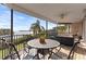 Inviting balcony features elegant furniture and a stunning water view for relaxing or entertaining at 2077 N Pointe Alexis Dr, Tarpon Springs, FL 34689