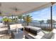 Charming outdoor seating area offers scenic views and comfortable furniture for enjoying the waterfront breeze at 2077 N Pointe Alexis Dr, Tarpon Springs, FL 34689