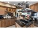 Gourmet kitchen with stainless steel appliances, granite countertops, and ample custom cabinetry with seamless flow to living space at 2077 N Pointe Alexis Dr, Tarpon Springs, FL 34689