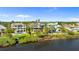 Beautiful waterfront homes line the coast, offering stunning views and a luxurious lifestyle at 2077 N Pointe Alexis Dr, Tarpon Springs, FL 34689