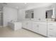 Bright, modern bathroom featuring double sinks, a large soaking tub, and a separate shower at 21181 Threadfin Way, Land O Lakes, FL 34638