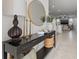 Elegant entryway with console table, decorative mirror, and view into the living area at 21181 Threadfin Way, Land O Lakes, FL 34638