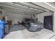 Spacious two-car garage featuring a parked car, a door to the interior and plenty of storage space at 21181 Threadfin Way, Land O Lakes, FL 34638
