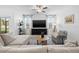Inviting living room featuring neutral tones, comfortable seating, and a large flat-screen television at 21181 Threadfin Way, Land O Lakes, FL 34638