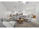 Open-concept living space featuring modern furnishings, sleek finishes, and abundant natural light at 21181 Threadfin Way, Land O Lakes, FL 34638