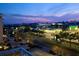 City view at night with illuminated buildings, lush landscaping and neighborhood shopping at 223 Island Way # 7H, Clearwater, FL 33767