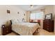 Comfortable bedroom featuring a window, a television, and a desk at 2370 Jamaican St # 30, Clearwater, FL 33763