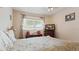 Comfortable bedroom featuring a window, a television, and a desk at 2370 Jamaican St # 30, Clearwater, FL 33763