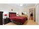 A comfortable bedroom featuring a queen-sized bed and laminate flooring at 2370 Jamaican St # 30, Clearwater, FL 33763