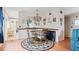 A dining area with a round table under an elegant chandelier at 2370 Jamaican St # 30, Clearwater, FL 33763