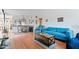 A cozy living room with bright laminated floors and comfortable blue furniture at 2370 Jamaican St # 30, Clearwater, FL 33763