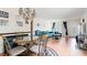 A comfortable living room that features an open dining area with laminated flooring at 2370 Jamaican St # 30, Clearwater, FL 33763