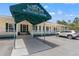 Tampa Bay Golf and Country Club Activities Center entrance featuring a covered awning at 29500 Blackwolf Run Loop, San Antonio, FL 33576