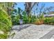 Spacious backyard with brick patio, mature trees, and an outdoor grill at 3510 Brook Crossing Dr, Brandon, FL 33511
