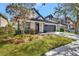 Beautiful home with a well-kept lawn, elegant black trim, and a convenient attached two-car garage at 3510 Brook Crossing Dr, Brandon, FL 33511