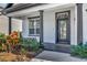 Inviting front entrance featuring black columns, a black-trimmed door and the house number above the doorway at 3510 Brook Crossing Dr, Brandon, FL 33511