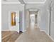 Open hallway featuring an archway and tile floors that leads to multiple rooms throughout the home at 3510 Brook Crossing Dr, Brandon, FL 33511