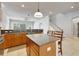Spacious open-concept kitchen featuring a center island with seating and a seamless flow to the living area at 3510 Brook Crossing Dr, Brandon, FL 33511