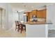 Kitchen features granite countertops, stainless steel appliances, and raised bar with seating at 3510 Brook Crossing Dr, Brandon, FL 33511