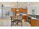 Kitchen features stainless steel appliances, granite countertops, and raised bar with seating at 3510 Brook Crossing Dr, Brandon, FL 33511