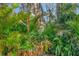 Private outdoor shower surrounded by lush tropical landscaping providing ultimate relaxation and seclusion at 3510 Brook Crossing Dr, Brandon, FL 33511