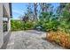 Spacious backyard patio with pavers and stainless steel grill, perfect for outdoor entertaining with lush landscaping at 3510 Brook Crossing Dr, Brandon, FL 33511