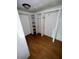 Walk in closet featuring shelving and wood flooring at 3521 Sumner Rd, Dover, FL 33527