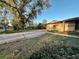 Charming single-story home with mature landscaping in the front yard, providing ample shade and curb appeal at 3521 Sumner Rd, Dover, FL 33527