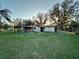 View of single-story home showcasing its covered patio, ideal for outdoor entertaining at 3521 Sumner Rd, Dover, FL 33527