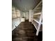 Unfinished room with white shelves and wood look flooring at 3521 Sumner Rd, Dover, FL 33527