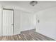 Bedroom featuring wood-look flooring and white trim at 3819 Queensboro S Ave, St Petersburg, FL 33711