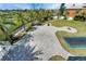 Backyard with ample patio space, fire pit, basketball hoop, and trampoline at 401 Bahama Grande Blvd, Apollo Beach, FL 33572