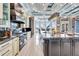 Spacious kitchen with a marble island, custom cabinetry, and state-of-the-art appliances at 401 Bahama Grande Blvd, Apollo Beach, FL 33572