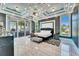 Luxurious main bedroom with tray ceiling, modern fixtures, and access to the outdoor kitchen at 401 Bahama Grande Blvd, Apollo Beach, FL 33572