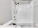 Clean bathroom featuring a shower and tub combination with white tile surround at 4049 Dolphin Dr, Tampa, FL 33617