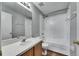 Bathroom featuring a tub with shower, a vanity, and a sink at 4049 Dolphin Dr, Tampa, FL 33617