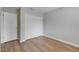 Neutral bedroom with a closet with bright lighting and wood-look flooring at 4049 Dolphin Dr, Tampa, FL 33617
