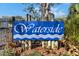 Waterside community sign with lush landscaping around the entrance at 4049 Dolphin Dr, Tampa, FL 33617