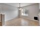 An open concept dining area featuring tile floors and a modern light fixture at 4049 Dolphin Dr, Tampa, FL 33617