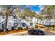 Exterior view of the two story condo building with well-manicured landscaping at 4049 Dolphin Dr, Tampa, FL 33617