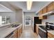 Bright kitchen featuring wooden cabinets, stainless steel appliances, and tile flooring at 4049 Dolphin Dr, Tampa, FL 33617