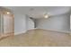 Spacious living room with tile flooring, neutral walls, and a ceiling fan at 4049 Dolphin Dr, Tampa, FL 33617